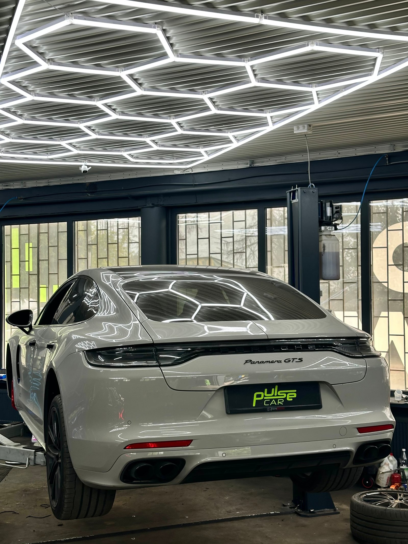 White Porsche Panamera GTS in the workshop