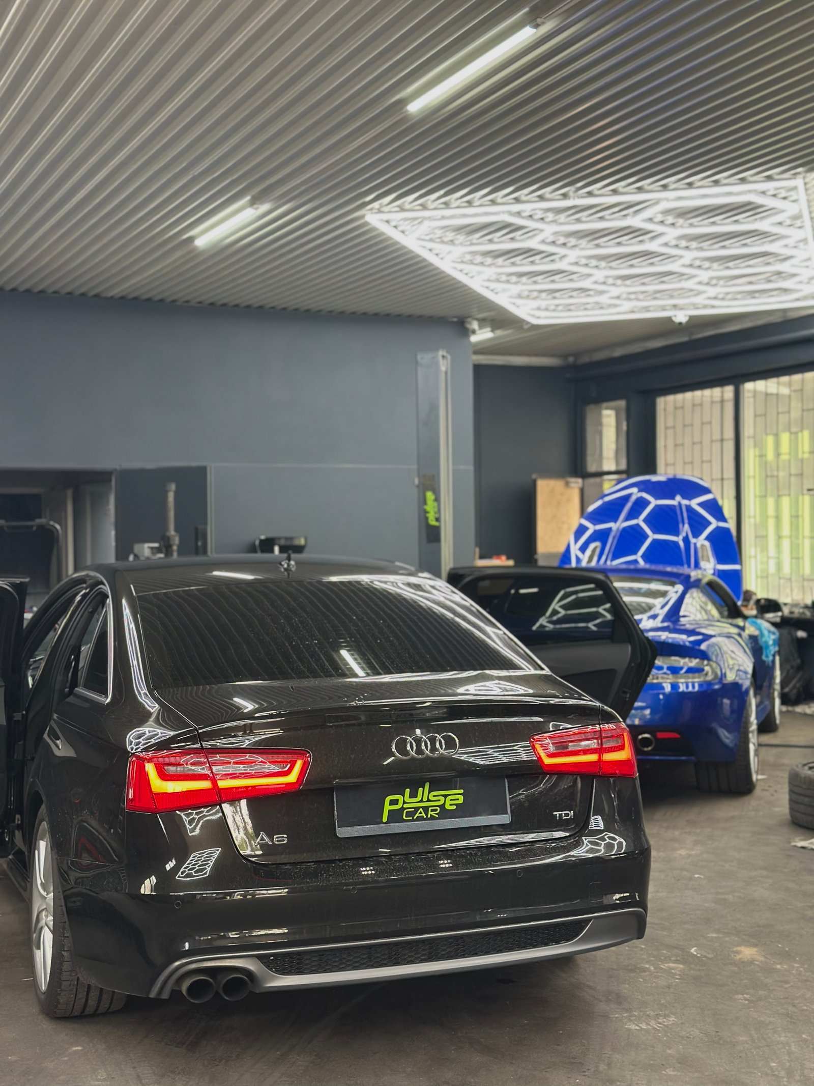 Black Audi A6 in the workshop